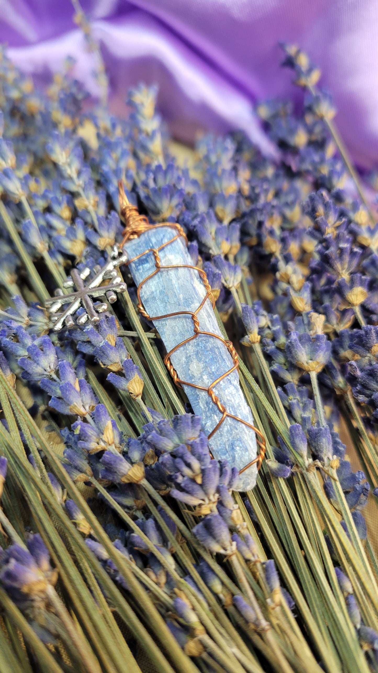 Wire wrapped blue kyanite crystal necklace with snowflake charm